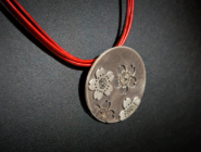 Necklace on red leather