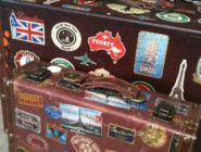 Old Bus Depot Markets - Collectable Sunday Stallholder, Remys. Vintage suitcase covered with stickers