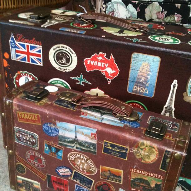 Old Bus Depot Markets - Collectable Sunday Stallholder, Remys. Vintage suitcase covered with stickers