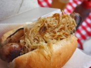 German style sausages served on crusty baguette with sauerkraut, at the Old Bus Depot Markets by Stallholder at The Slab - The Brathaus