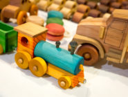 Colourful wooden train at the Old Bus Depot Markets Theme Event, Kids in the Shed