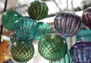 Purple and green round glass Christmas decorations at the Old Bus Depot Markets