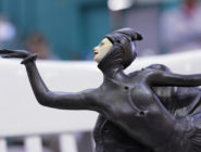 Vintage female jester statuette at the Old Bus Depot Markets Theme Event, Portobello Road