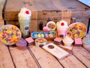 Colour and deceiving food items that are candles, by stallholder Wyx and Wax at the Old Bus Depot Markets