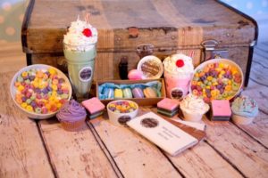 Colour and deceiving food items that are candles, by stallholder Wyx and Wax at the Old Bus Depot Markets