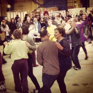 Jumptown Swing performing at the Old Bus Depot Markets eith a crowd watching