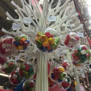 Lego filled Christmas baubles on wooden tree at Old Bus Depot Markets