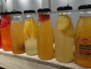 Glass bottles of organic Kombucha made by Old Bus Depot markets Stallholder, Gift of our Earth