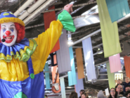 Milo the Clown performing at the Old Bus Depot Markets for their annual theme event, Kids in the Shed